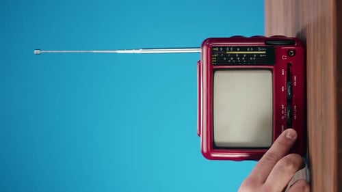 Turning On a Red Retro Television