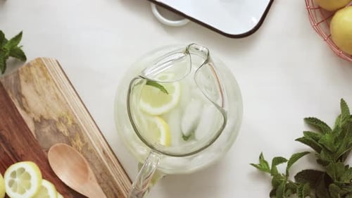 Refreshing Lemonade Preparation with Lemons and Mint