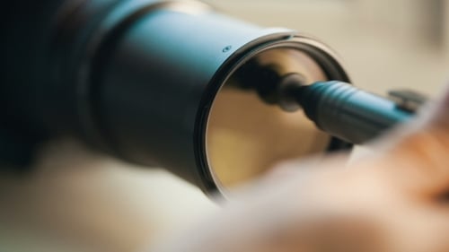 Hand Cleaning Dirty Lens
