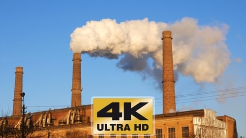 Factory Plant Smoke Stack Over Blue Sky Background