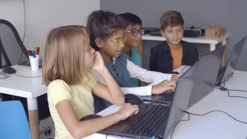 Row of Pupils Working on Task Together