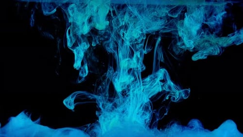 Turquoise Ink Flowing in Dark Liquid Abstractly