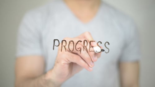 Man Writing Progress on Invisible Screen