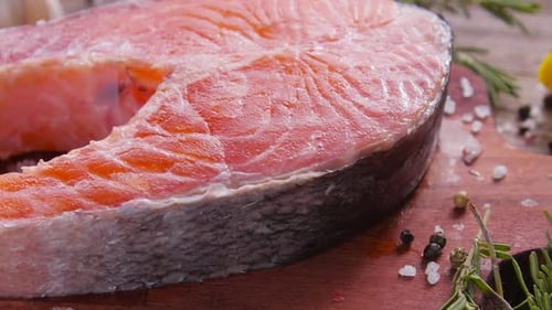 Close Up Of Fresh Salmon Steak with Seasoning