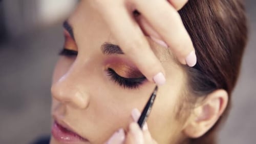 Applying Black Eyeliner on the Upper Lashline Close Up Slow Motion Footage