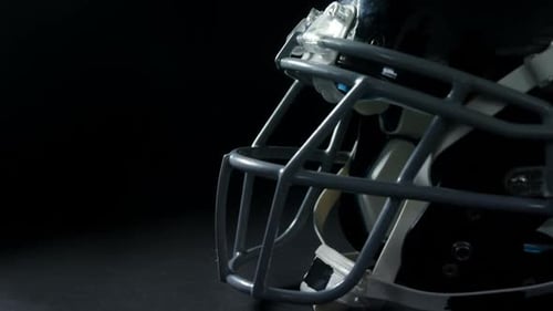 Close-up of American football player looking upwards