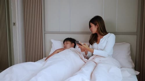 Young woman disturbs husband sleeping on night