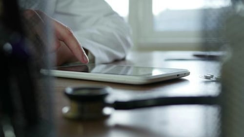 Doctor Sms Typing On Tablet