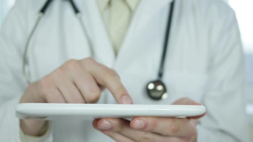 Doctor Using Tablet Pc