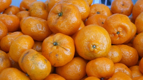 Orange Falling In Basket