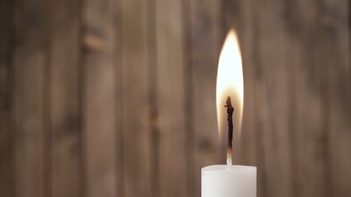 Close Up of a Candle Burning and Extinguishing