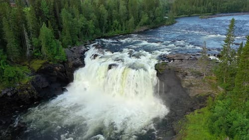 Aerial View of Scenic Waterfall in Lush Forest
