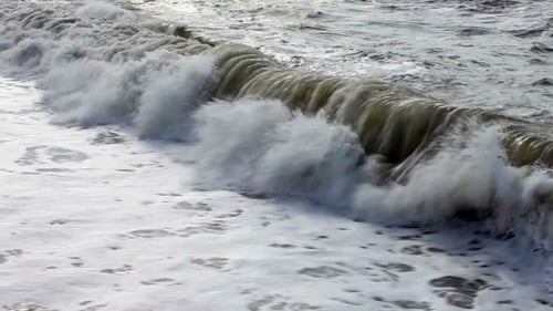 Waves Rolling On The Beach On a Stormy Day