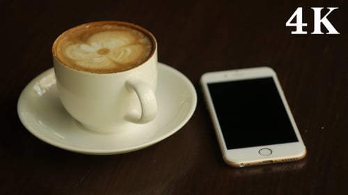 Coffee and Phone on a Table