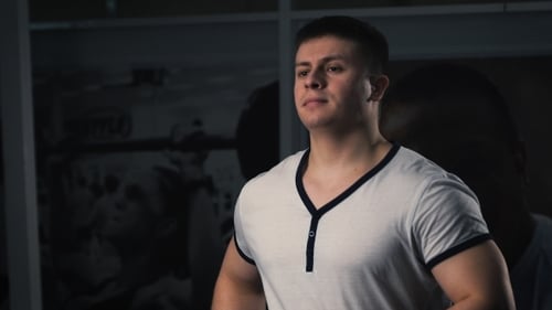 Man On Running Machine In Gym