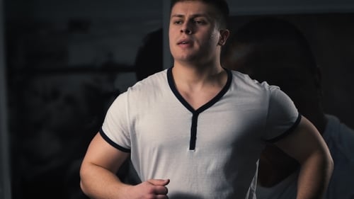 Man On Running Machine In Gym