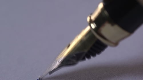 Close Up of Fountain Pen Writing on Paper