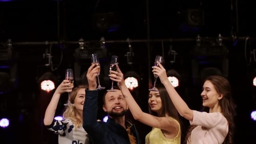 Group Cheers Champagne Glasses at Nighttime Party