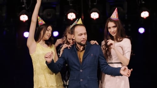 Friends Dancing with Party Hats in Nightclub Setting