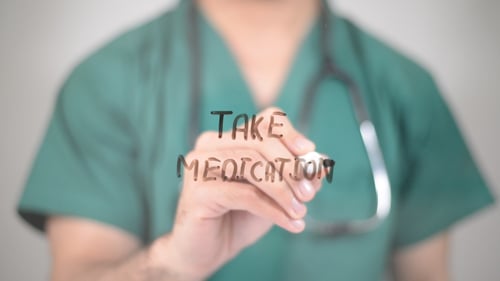 Doctor Writes 'Take Medication' On Glass Surface