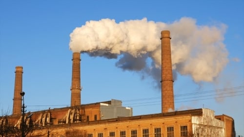 Factory Plant Smoke Stack Over Blue Sky Background