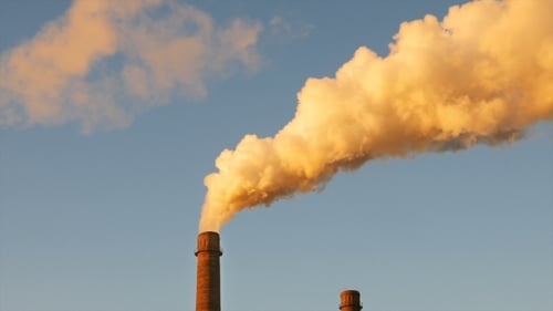 Factory Plant Smoke Stack Over Blue Sky Background