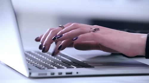 Female Hands Wrighting On Laptop
