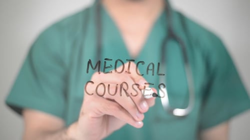Doctor Writes Medical Courses on Clear Surface