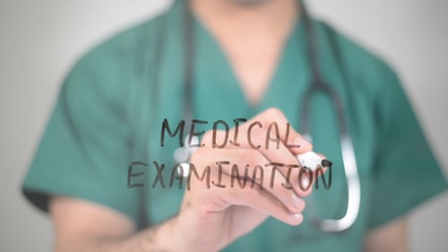 Doctor Writes Medical Examination on Glass Surface