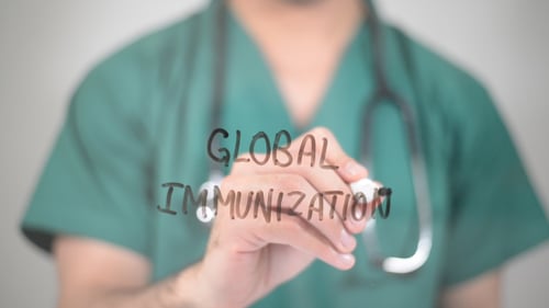 Medical Professional Writes Global Immunization Concept