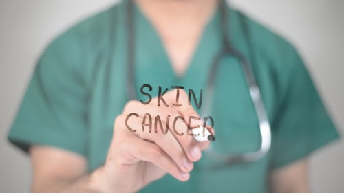 Physician Writes Skin Cancer on Transparent Screen