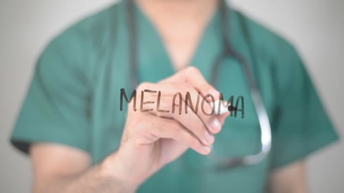 Doctor Writes the Word Melanoma