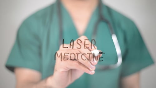 Doctor Writes Laser Medicine Concept in Studio