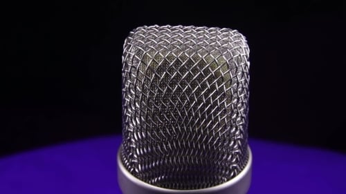 Studio Microphone Rotates On a Black Background