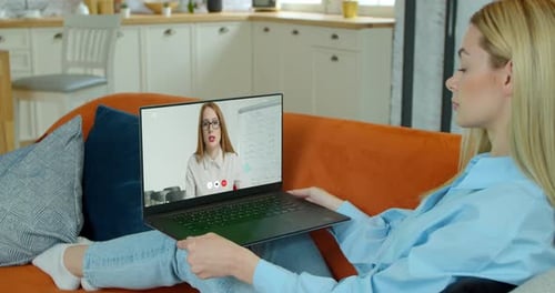 Woman Video Calling on Laptop in Living Room