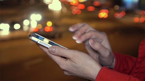 Using Smartphone at Night in City