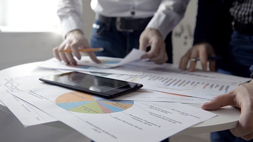 Business Meeting with Charts and Financial Review