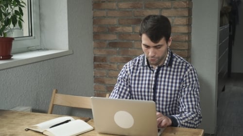 Man Concentrated Work At The Computer