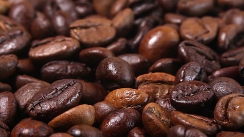 Pile of Dark Roasted Coffee Beans Close Up