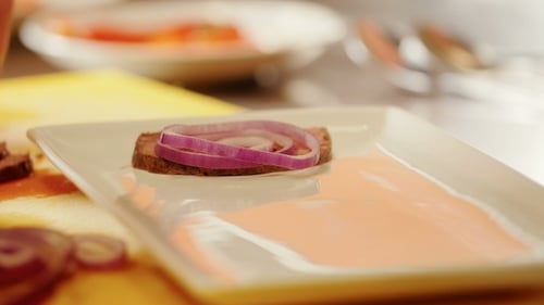 Preparing Sliced Beef with Red Onion Garnishing