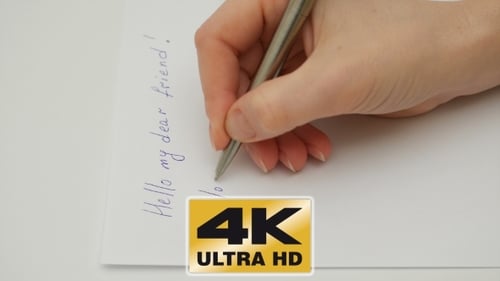 Female Hand Writes I Love You On The Paper Sheet