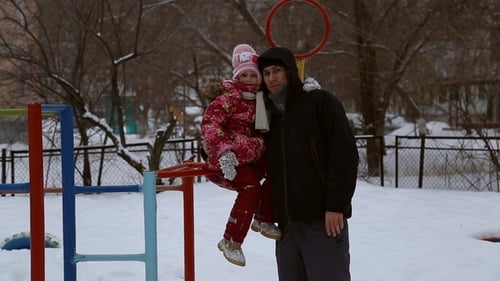 Dad and Daughter Play on Snowy Playground