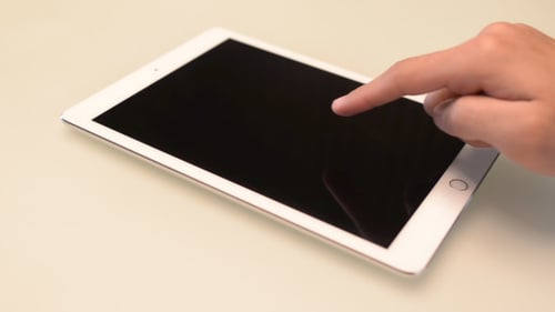 Finger Swiping and Tapping on Tablet Screen