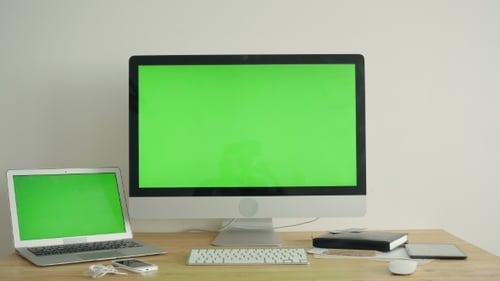 PC Display With Green Screen On The Table
