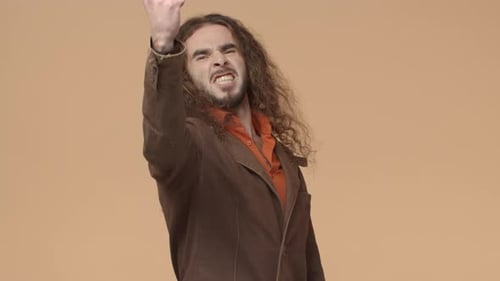 Man Flexes, Yells, and Smiles Intensely