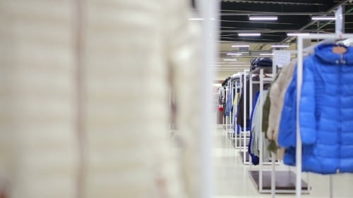 Various Clothes On Hangers In a Store