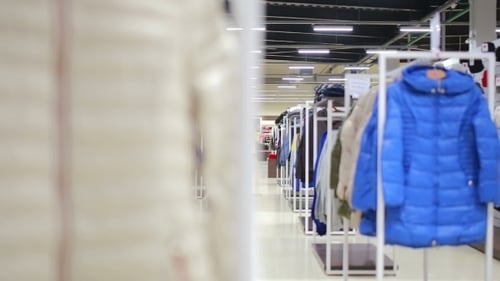 Various Clothes On Hangers In a Store