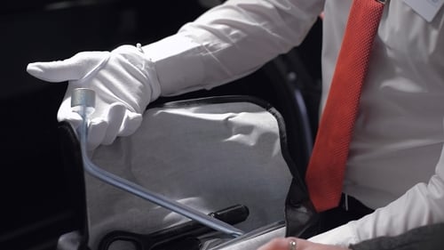 Gloved Hands Retrieving Auto Tools from Kit