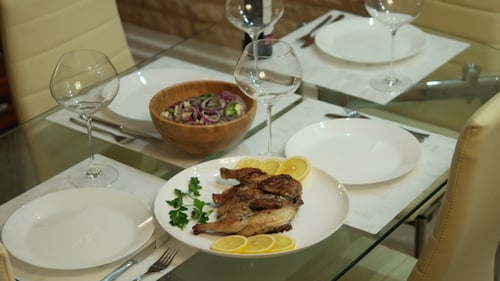 Elegant Table Setting with Plates and Wine Glasses