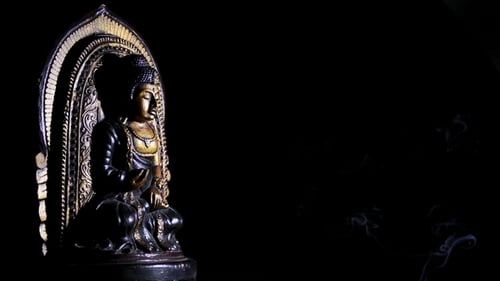 Buddha Statue on Black Background with Smoke